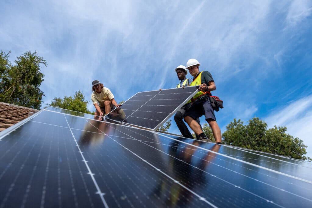 Engineers install solar panels on the roof of a residential house in Cape Town, South Africa. Source: iStock